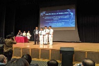 Three secondary students receiving the certification of distinction award