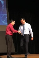 Professor William Chen receiving outstanding mentor award on stage