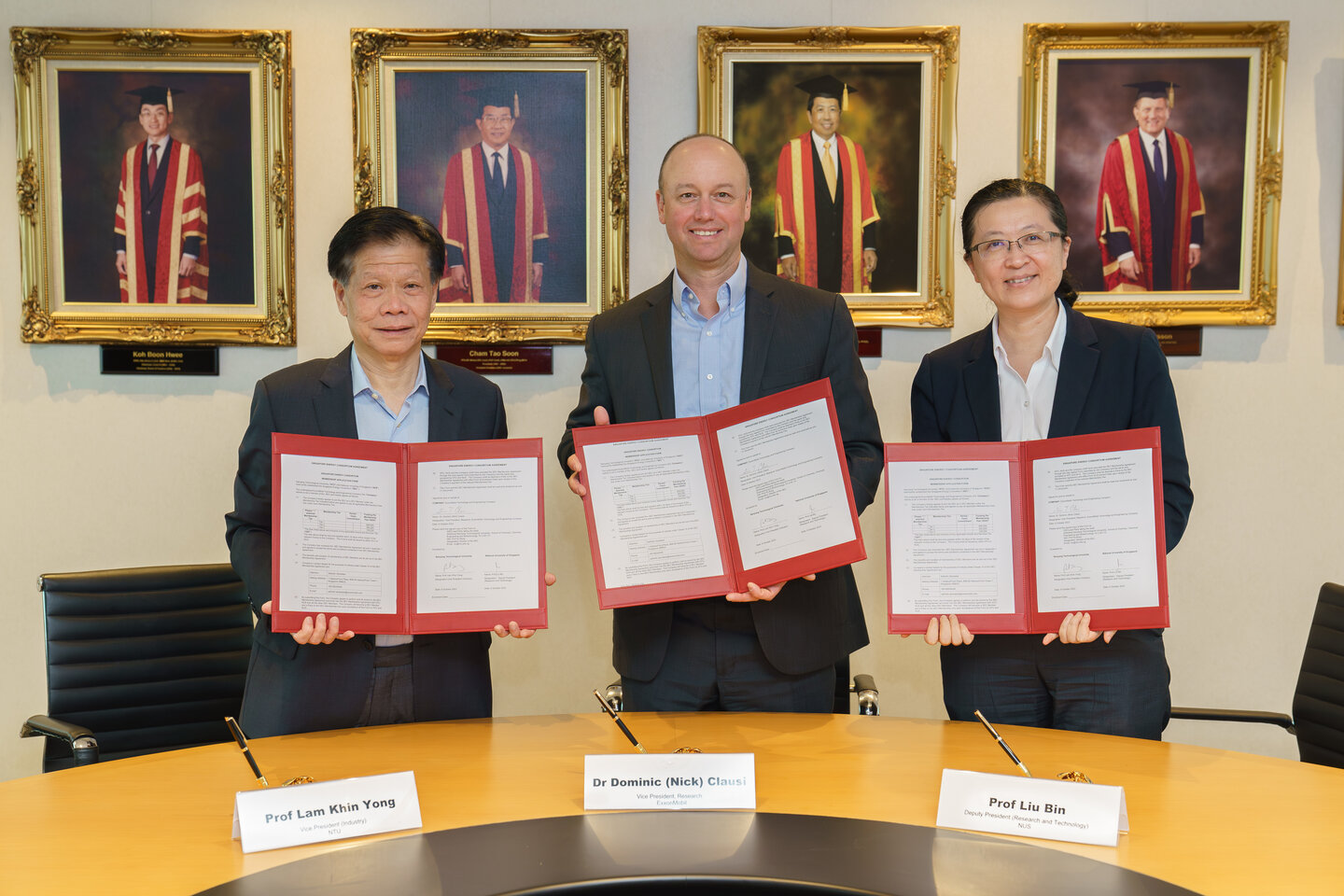 Prof Lam Khin Yong, Dr Dominic Clausi and Prof Liu Bin holding agreements