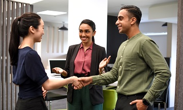 Handshake between students in business wear