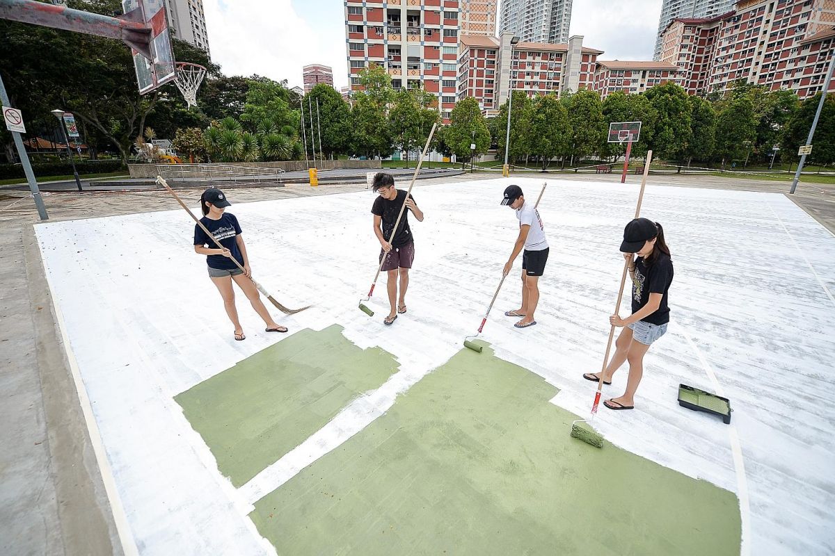 The rain was not going to deter artist Toby Tan from turning a rundown basketball court in
