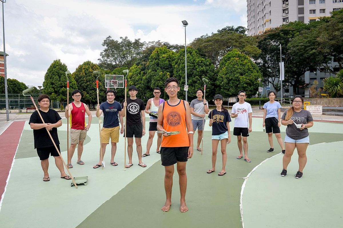 The rain was not going to deter artist Toby Tan from turning a rundown basketball court in