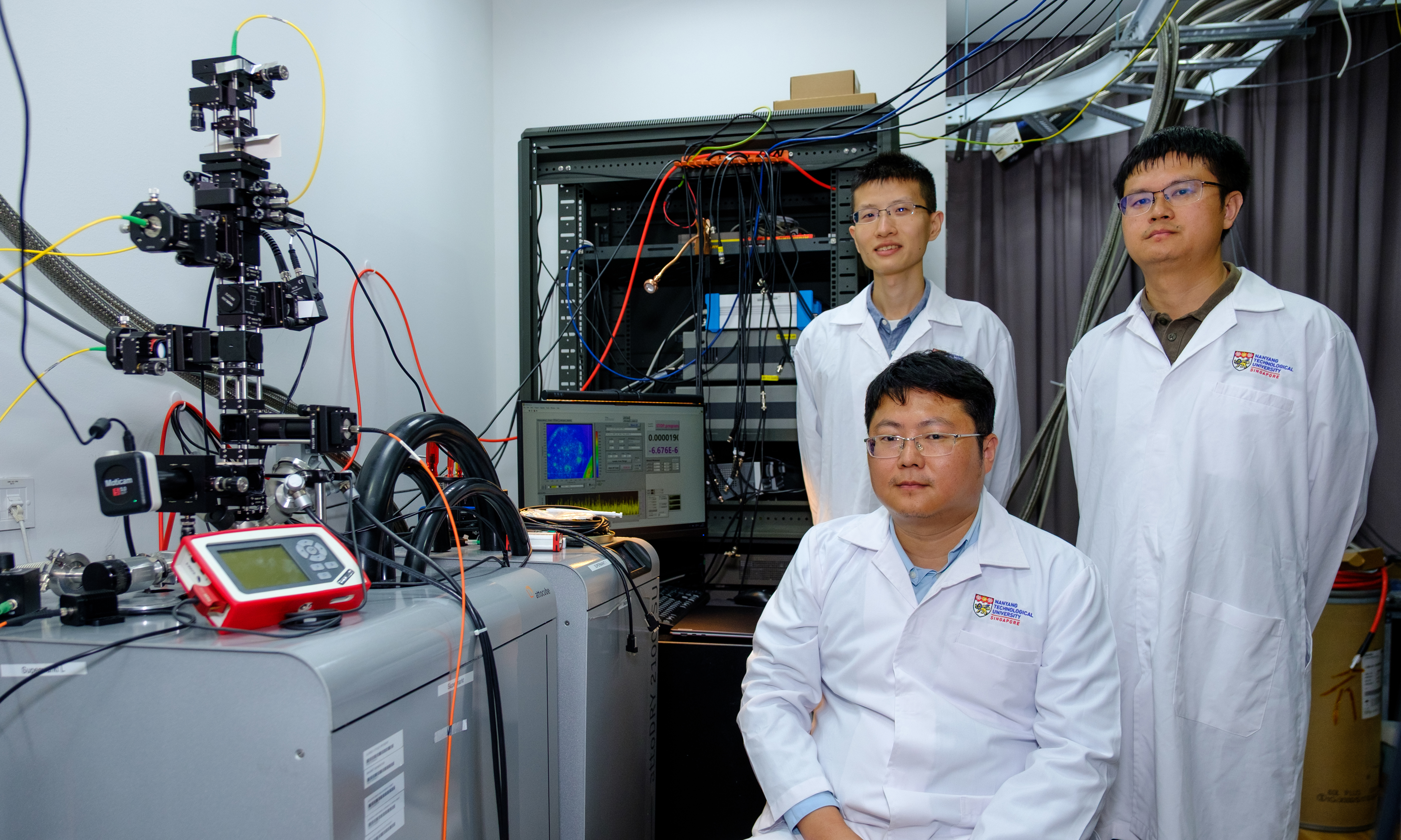 Dr Cai Xiangbin, Prof Gao Weibo and Dr Pan Haiyang from NTU's School of Electrical and Electronic Engineering