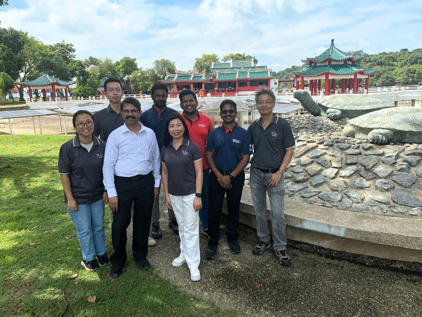The team from ERI@N and SLA photographed in front of the photovoltaic panels on Kusu Island, Singapore