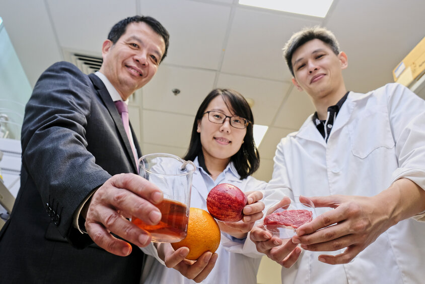 Professor William Chen and students presenting different types of food