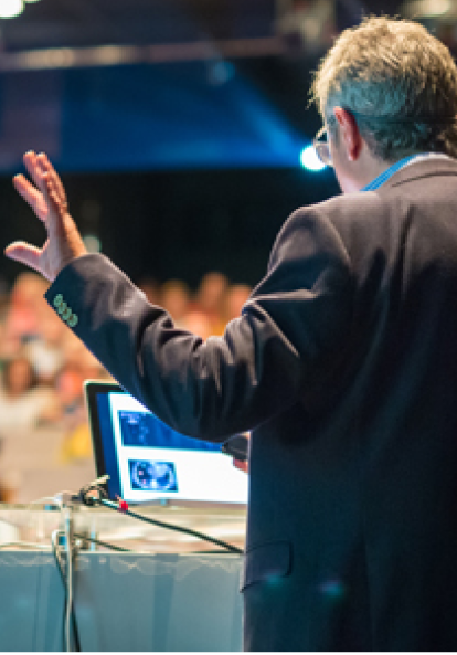 Speaker in a crowded university lecture hall