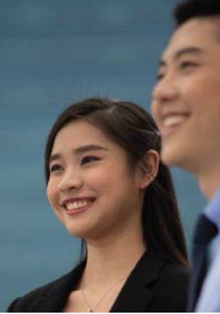 Two Nanyang Business School professional executives looking in the same direction