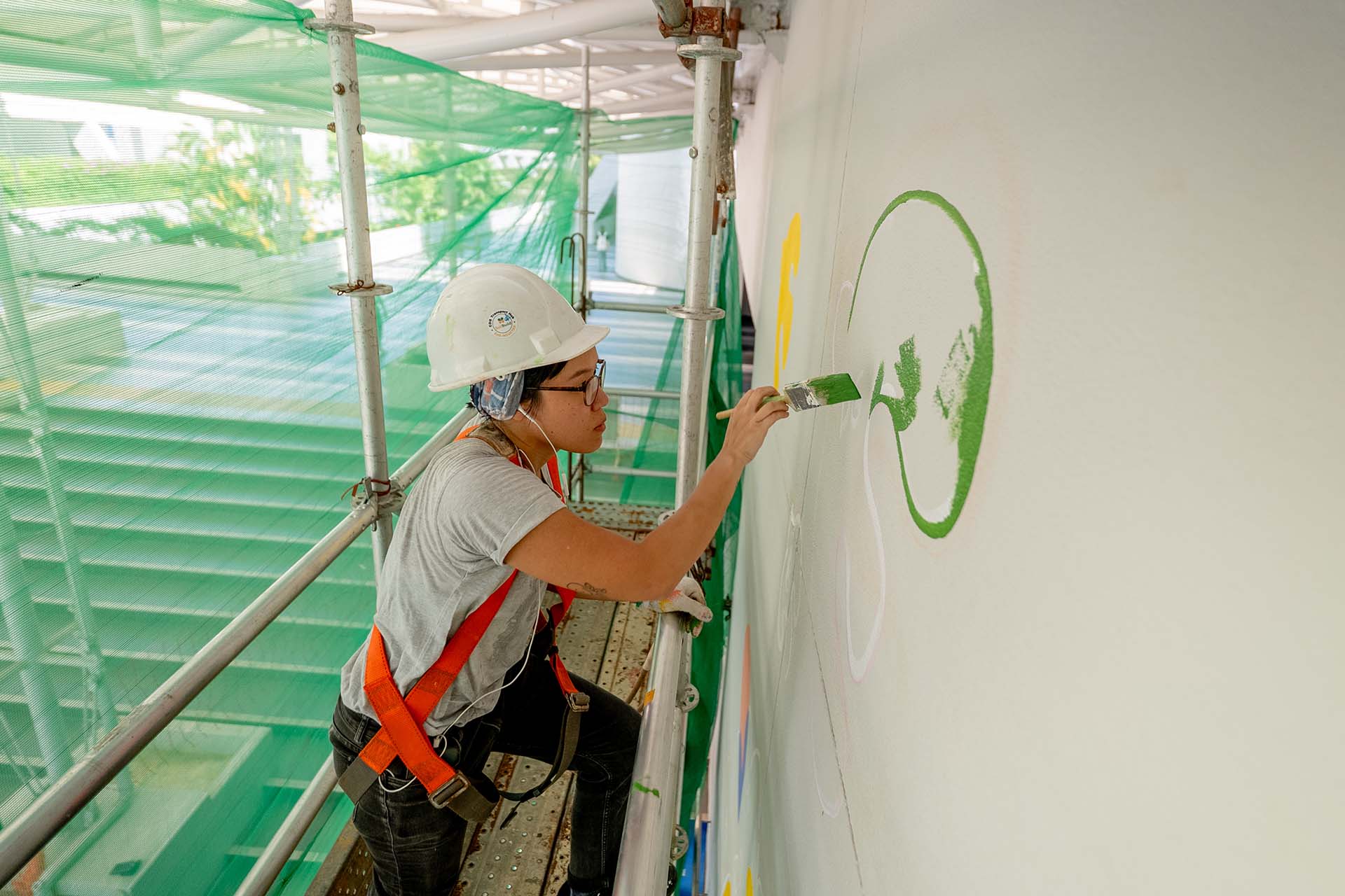 8EyedSpud Jackie painting the Becoming wall mural