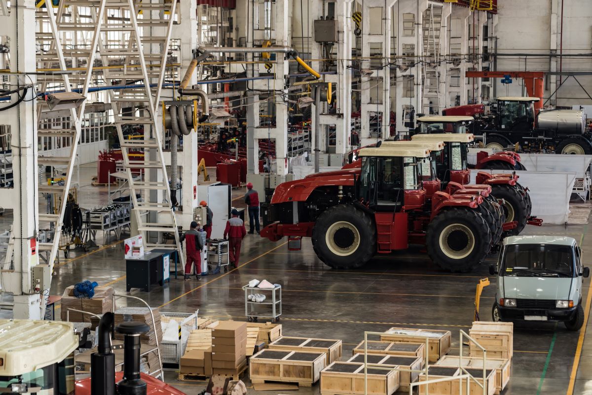 Assembly room at big industrial plant manufacturing tractors