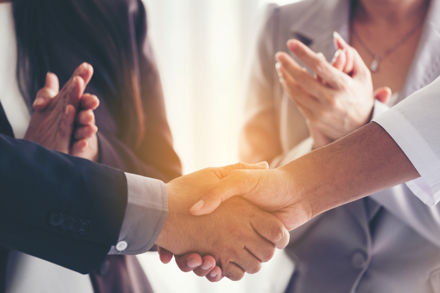 Businessmen making handshake - business etiquette, congratulation, merger
