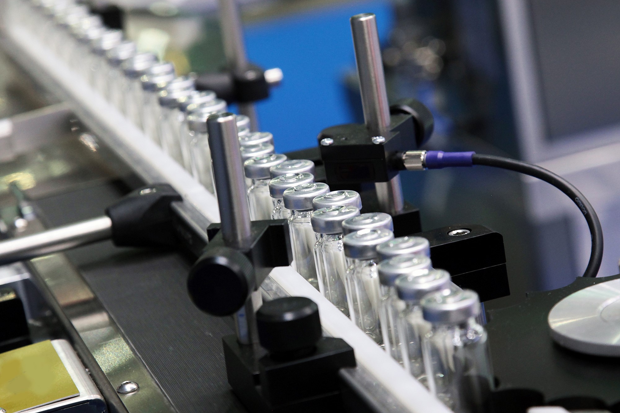 Medical vials on pharmaceutical manufacturing line.