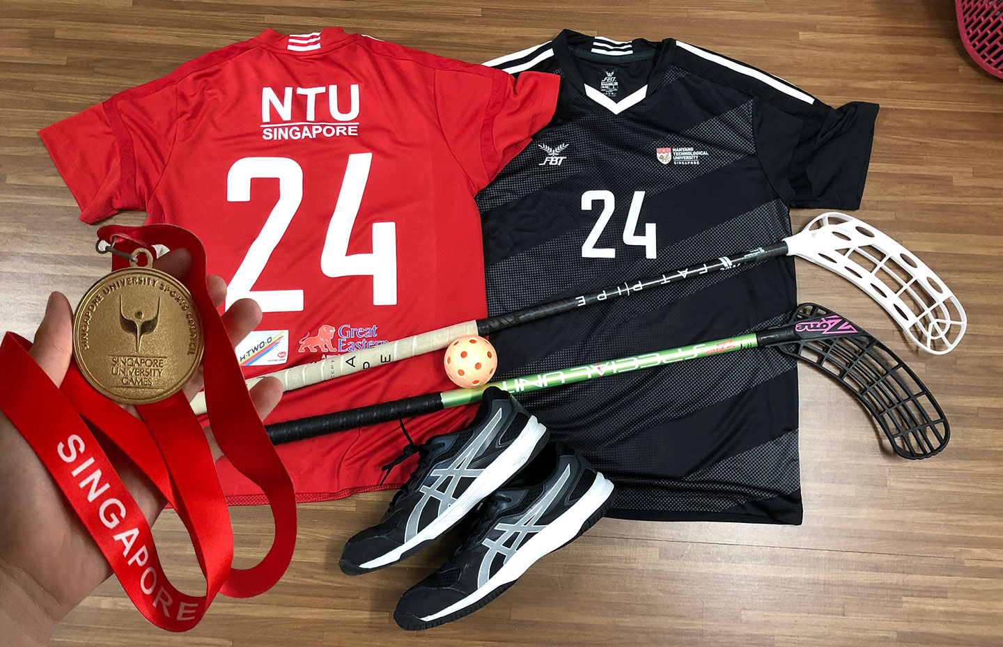 Photo of Lee Ray Sheng represented NTU in the Singapore University National Games (SUNIG) for floorball and won the tournament.