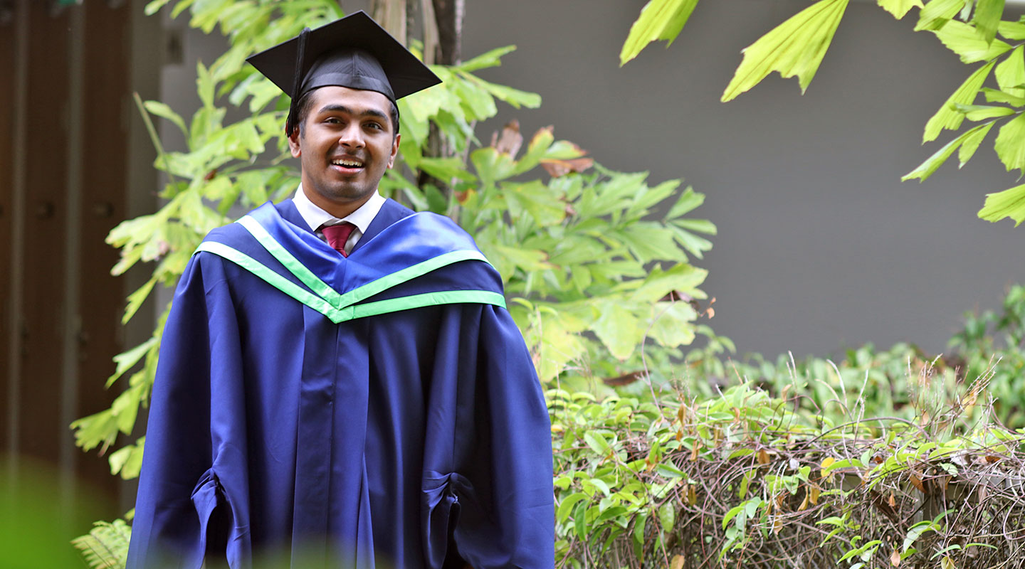 Photo of an university student in convocation gown.