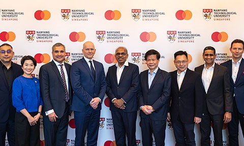 Thumbnail photo of a group peoples  standing infront of a Mastercard-NTU Joint Lab backdrop.