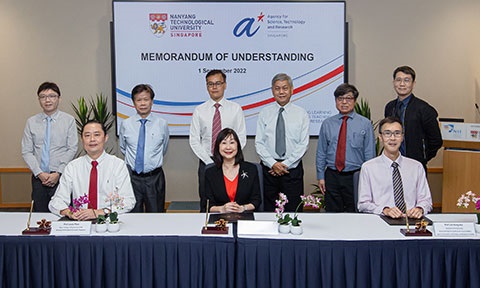Thumbnail photo of a group peoples at a MoU signing ceremony.