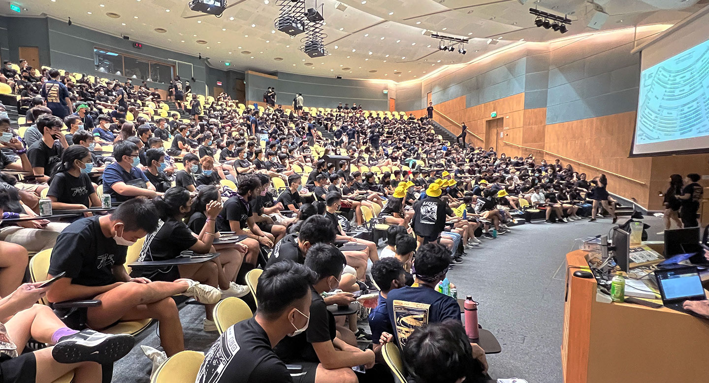 Photo of a large group of students in a Lecture Theatre.