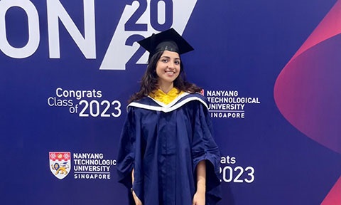 Photo of a female undergraduate in convocation gown and cap, SCSE valedictorian.