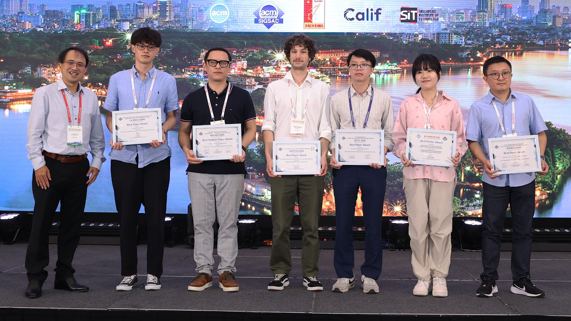 CCDS PhD Researcher Wang Siyi Wins Best Poster Award at ACM AsiaCCS 2025 standing with other award winners