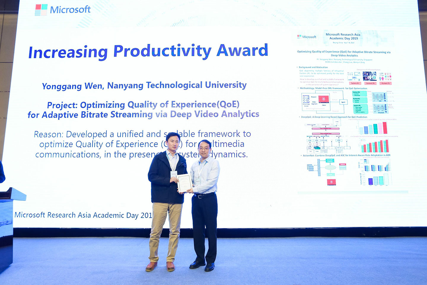 Dr Gao Guanyu received the award on behalf of Prof Wen Yonggang and team on stage during MSRA Academic Day 2019.