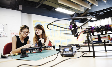 Two EEE students working on eee project