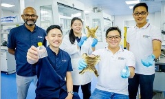 Group of researchers holding clinical grade collagen made from discarded bullfrog skin