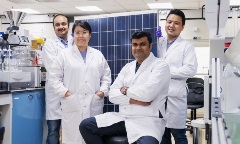 Group of scientists in white lab coats