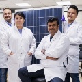 Group of scientists in white lab coats