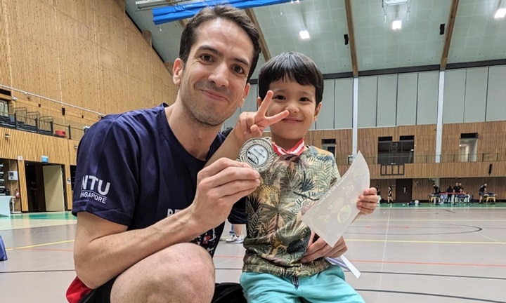 Asst Prof Houssineau with his four-year-old son, who cheered him on at the NTU X Campus Run. Photo credit – NTU CCO