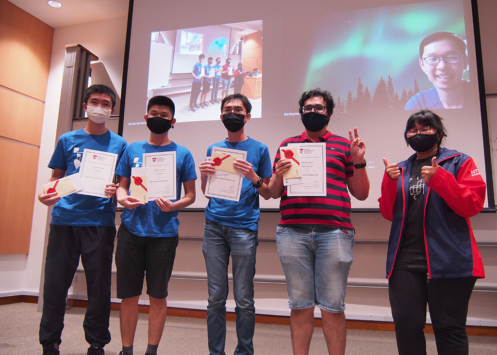 The winning team of Year 3 Physics students from NTU, Singapore: (from left) Teo Hau Tian, Chai Siao Yang, Teo Bi Hong, and Gupta Chaitanya, along with Soe Gon Yee Thant (right), a member of the organising committee. 