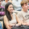 International students listening intently to sharing during forum