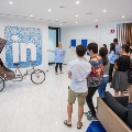 Participants listening to a sharing session at LinkedIn Singapore headquarters during a learning journey