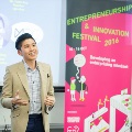 Male speaker sharing his experiences at Entrepreneurship and Innovation Festival 2016