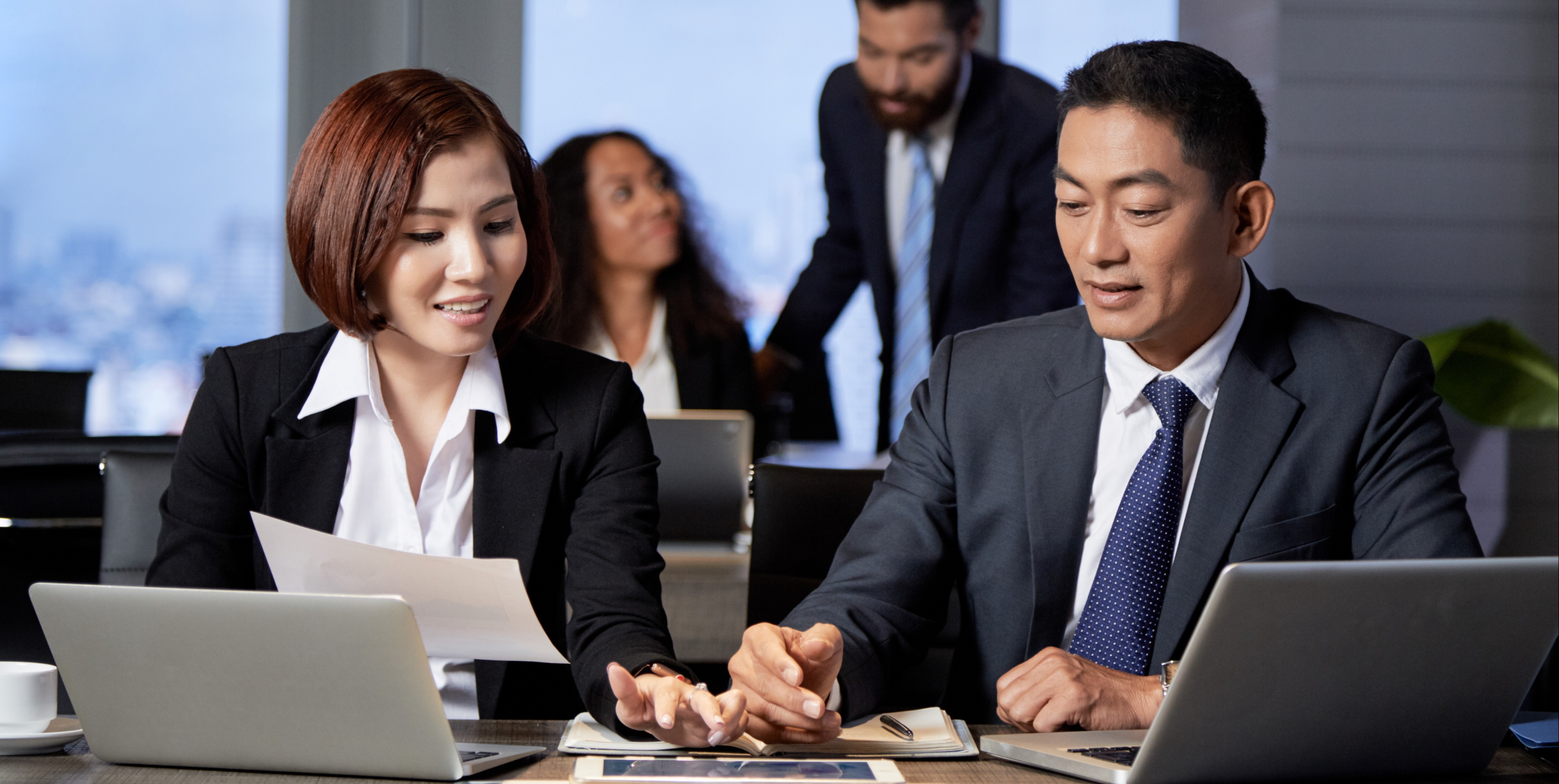 3. young-ethnic-coworkers-using-tablet