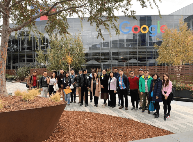 Students visiting Google headquarter overseas smiling group learning immersion
