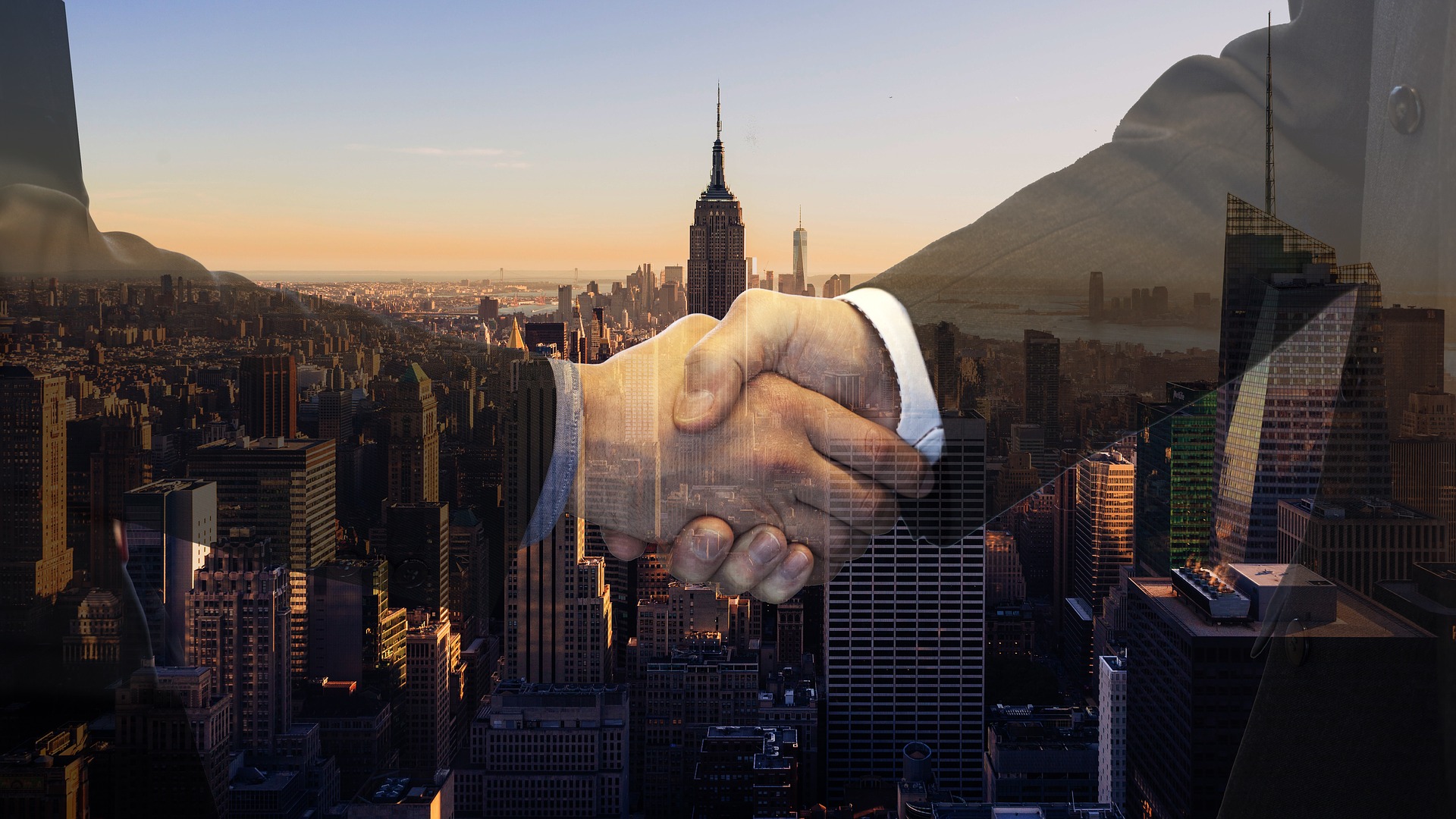 Business handshake in a global city