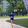 16 Female runner is all smiles as she finishes her race