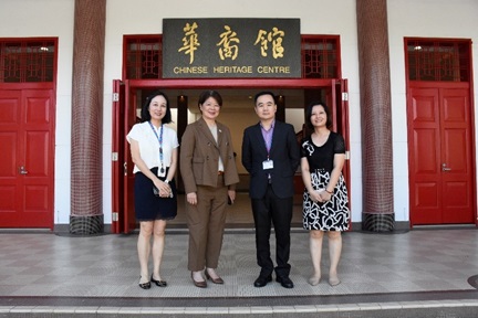 Ms Goh and CHC staff gathered at the entrance of CHC for a group photo