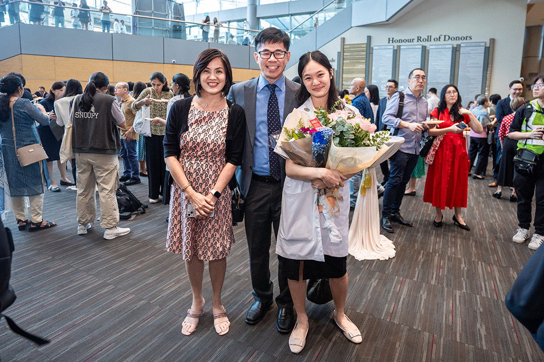 Happy family at white coat ceremony