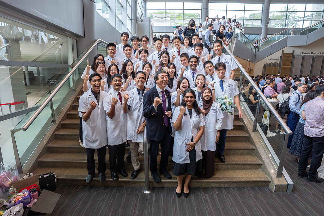 Prof Joseph Sung with kids white coat 2025
