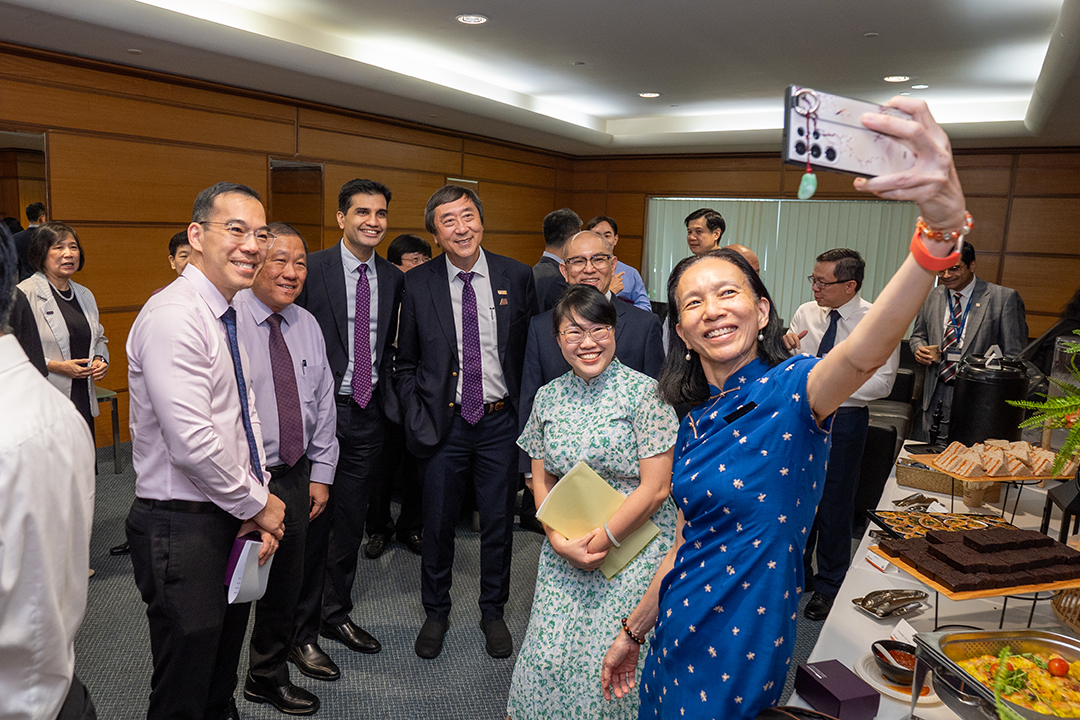 VIPs at White Coat Ceremony taking selfie