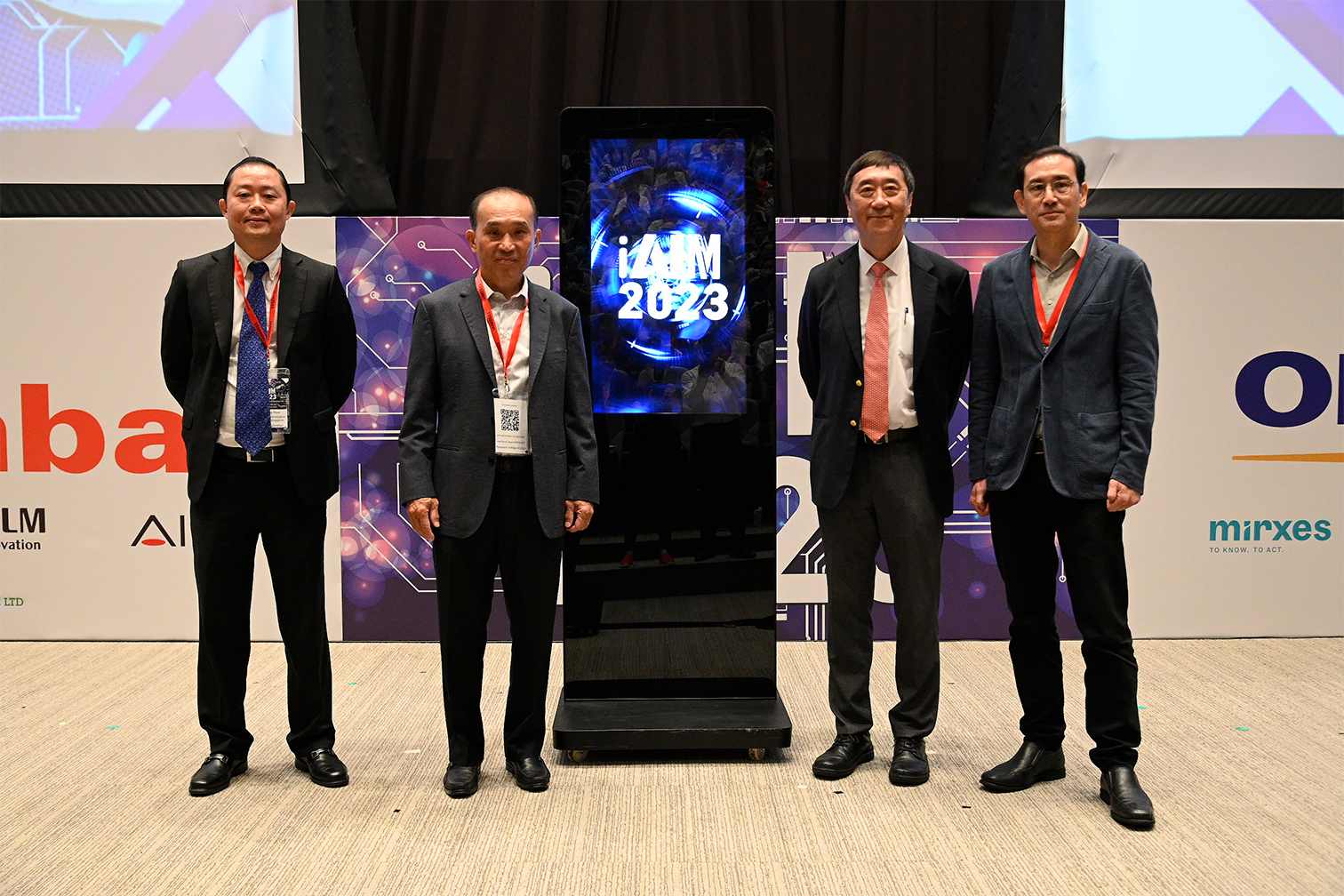 Group Photo taken at iAIM 2023 of Mr Tan Chuan Poh, Prof Joseph Sung, Prof Louis Phee and Prof Benjamin Seet