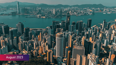 Futuristic cityscape of Hong Kong with the text August 2023 on bottom left of image