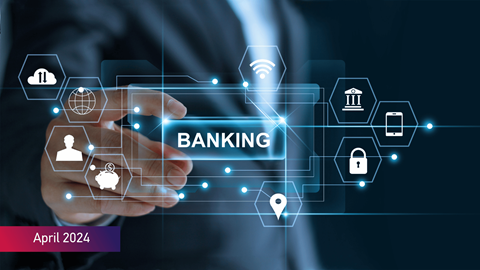 Businessman holding the word _Banking_ with network connection icons on a virtual dark screen background with April 2024 text on bottom left