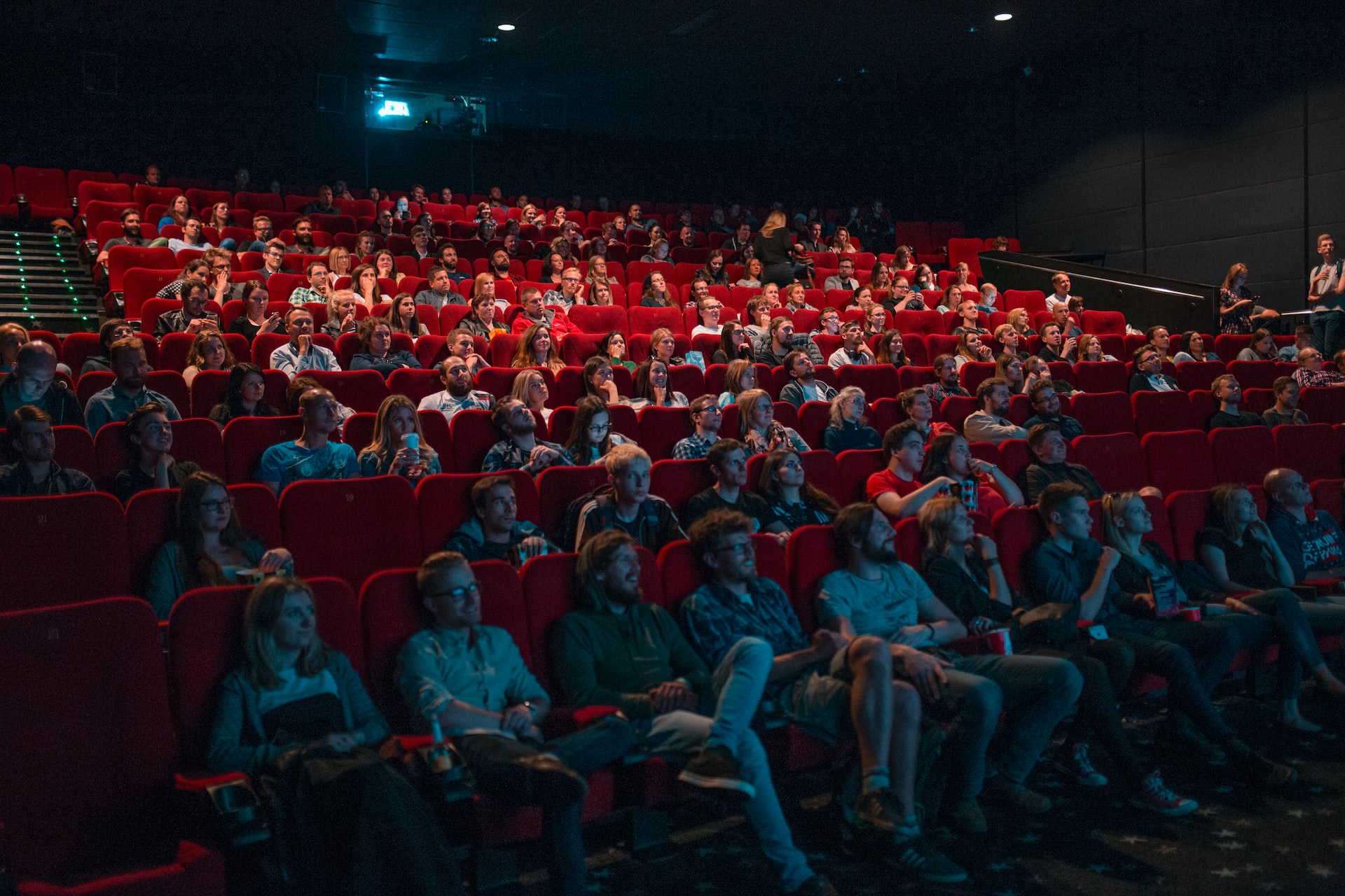 People seated in a cinema watching a movie