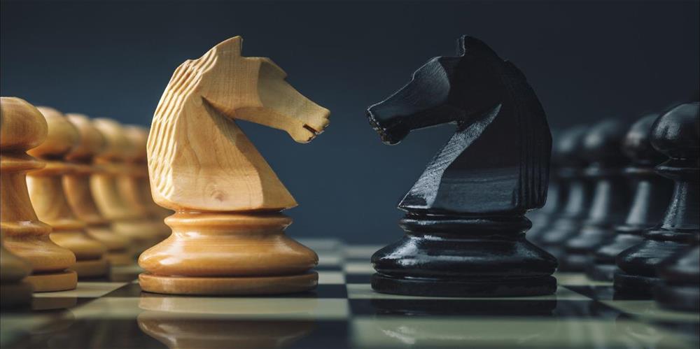 Two Knight chess pieces showing strategy