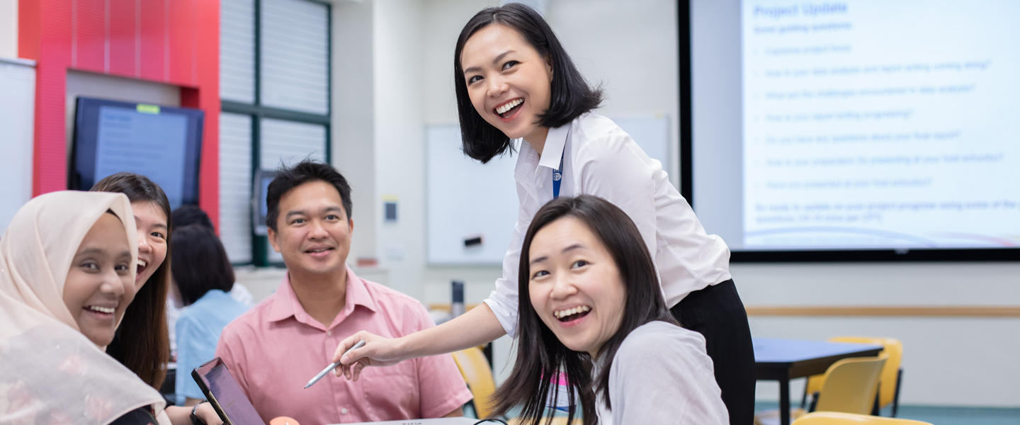 Classroom with a Teacher with Short Hair, Group of 4 Adults