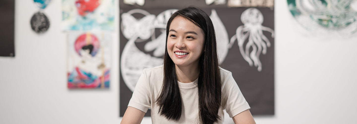 Smiling Girl with Art in the Background