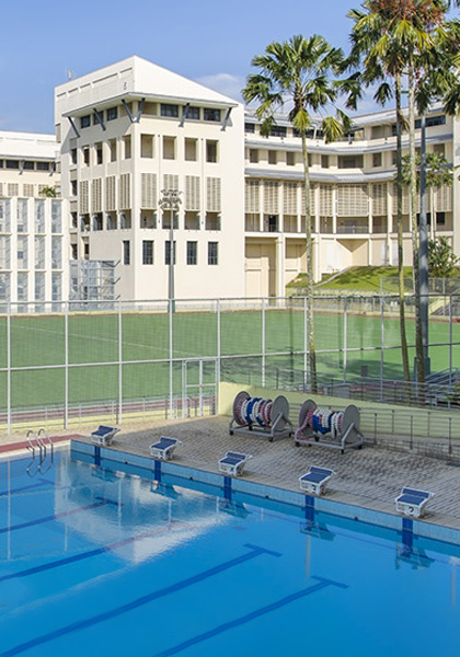 Swimming Pool and Palm Trees next to Track Field (mobile)