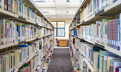 In Between Shot of Shelves of Books in a Library (480x288px)