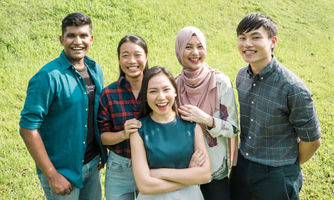 Smiling Group of 5 Students On A Grass Patch Chinese Girl Blue Red Gingham Plaid Top (480x288px)